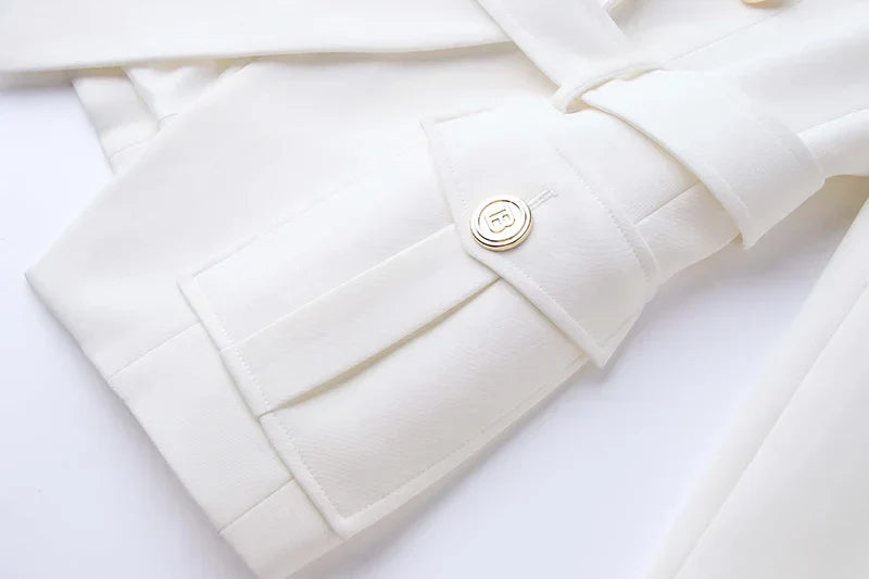 Luxury white pocket blazer with classic double-breasted design for women.