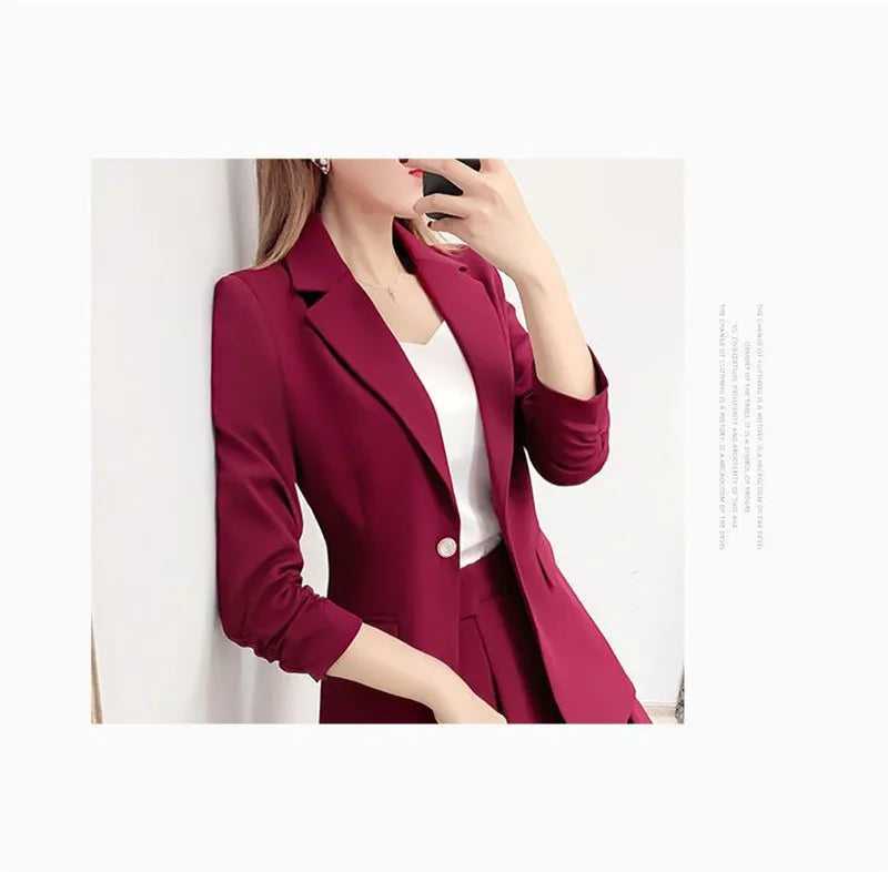 Elegant two-piece unlined blazer and A-line skirt suit in burgundy for women.