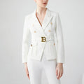 Luxury white women's pocket blazer with double-breasted closure and notched collar.