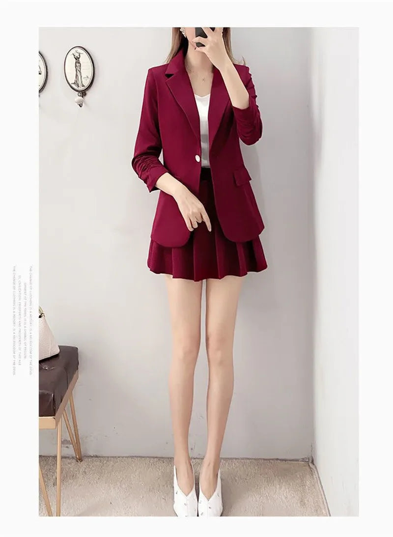 Elegant maroon blazer and A-line skirt suit for women.