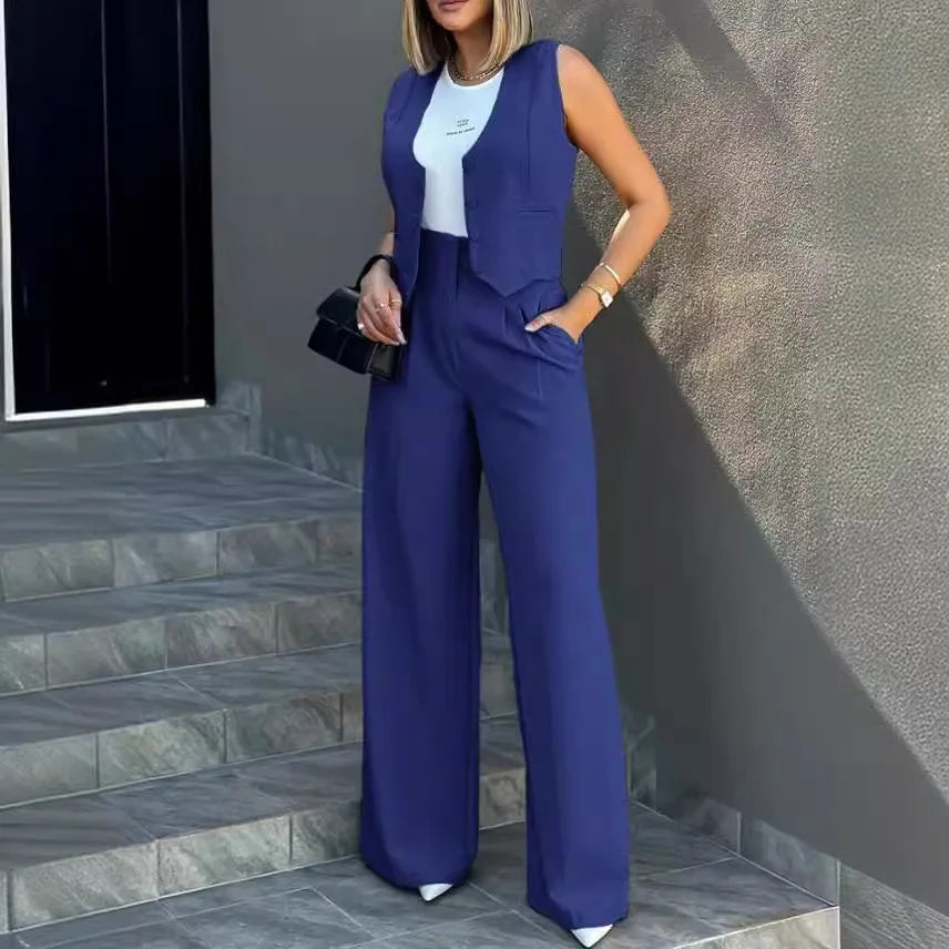 Women's blazer pant set with sleeveless notched blazer and high-waisted ankle-length pants in solid color, styled for office wear.