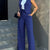 Women's blue sleeveless blazer and high-waist pant set, paired with a white top, showcasing a chic office lady style.