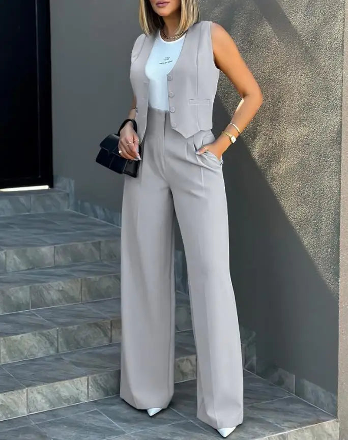 Women's casual slim notched blazer and high waist pant set in light grey, featuring a sleeveless cardigan style.