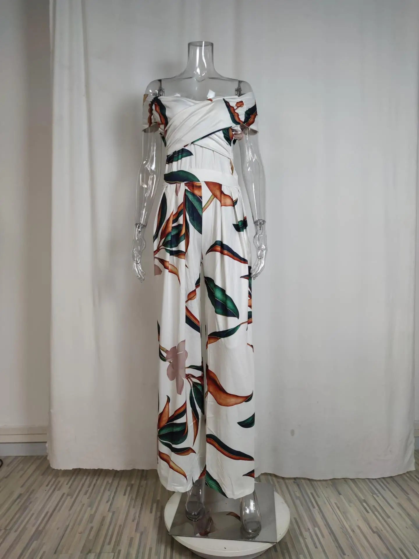 Fashion Printed Casual High Waist Jumpsuit Ladies Sexy Off Shoulder FlSPECIFICATIONSBrand Name: NoEnName_NullStyle: StreetwearAge: MIDDLE AGECraft of Weaving: TATOrigin: Mainland ChinaCN: GuangdongSeason: SummerMaterial: POLYESTERMaterDMEwomenstorenull