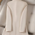 Beige long sleeve blazer with a notched collar and straight pattern, suitable for women.