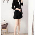 Elegant two-piece black blazer jacket and A-line skirt suit for women.