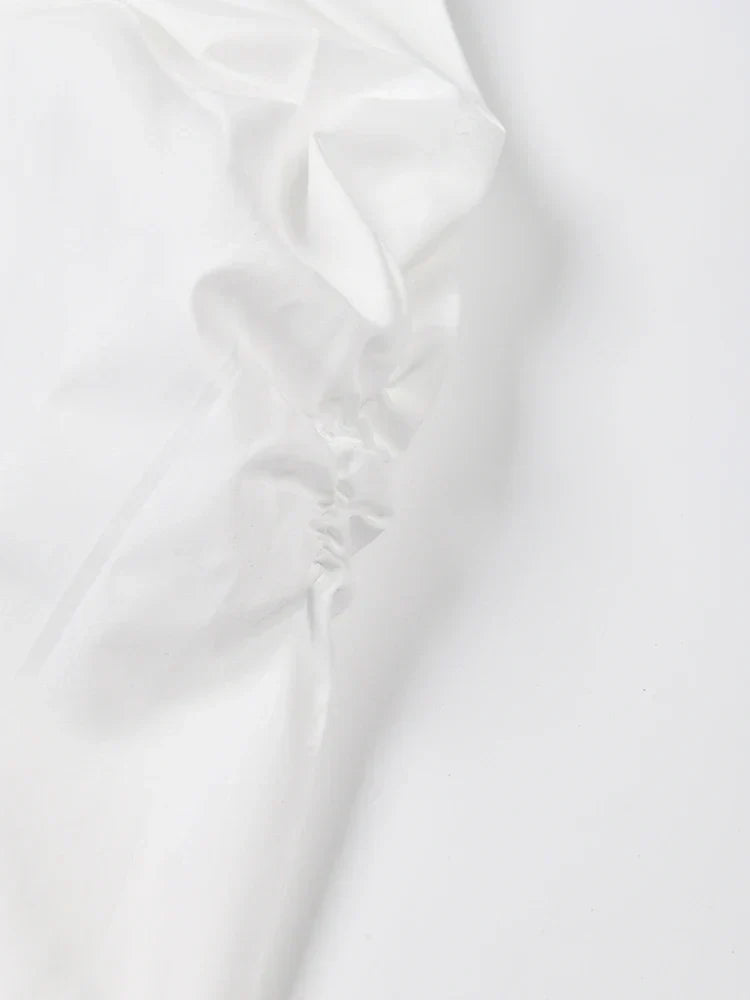 White contrast color designer coat detail showing fabric texture and style.