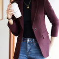 Elegant long-sleeve women's blazer with turn-down collar and single-button closure