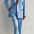 Women's two piece suit, light blue blazer and pencil pants set, office wear.